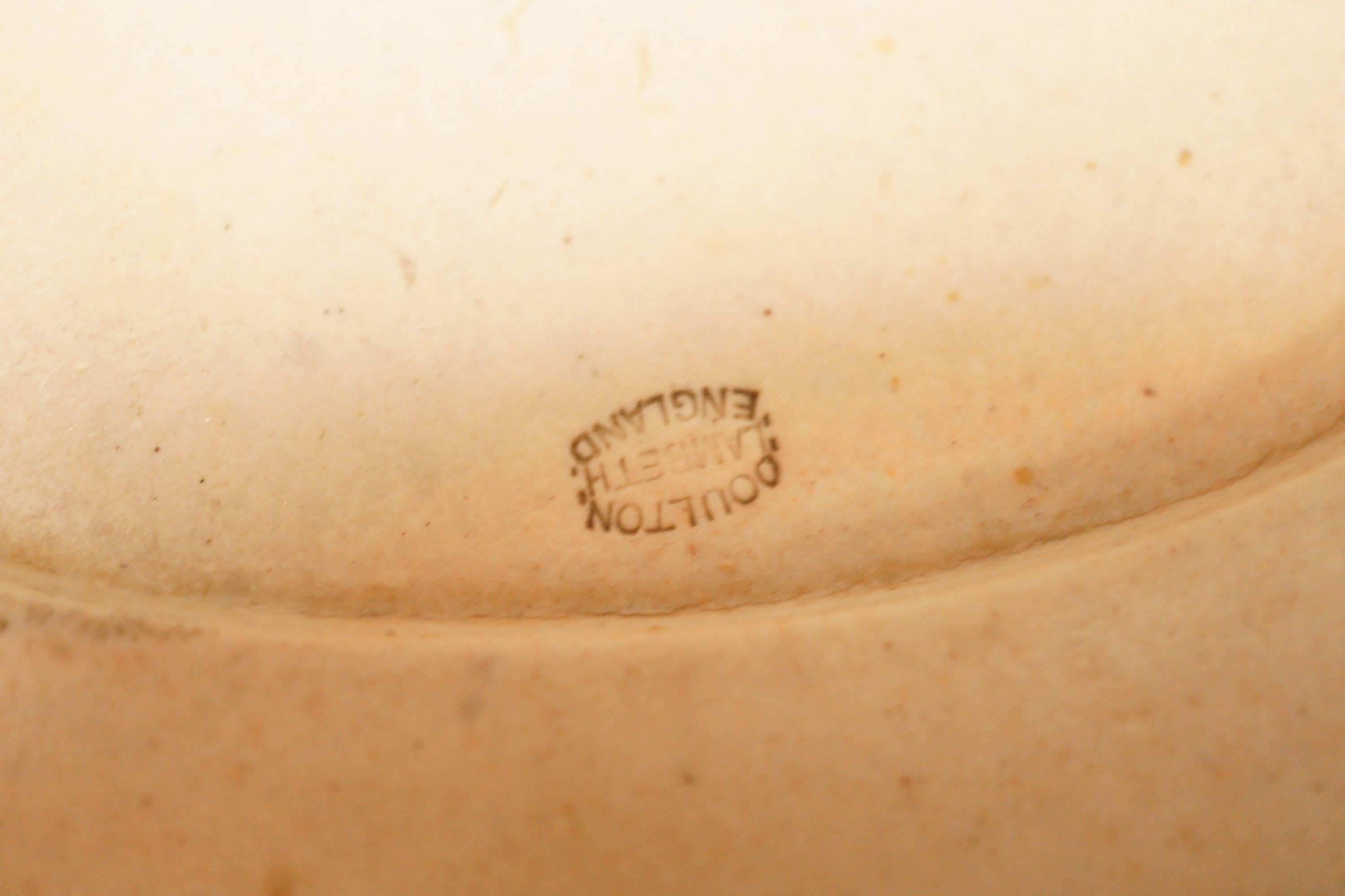 A Poole Delphis cat, a Doulton Lambeth soap dish and two Limoges dishes, tallest 29cm